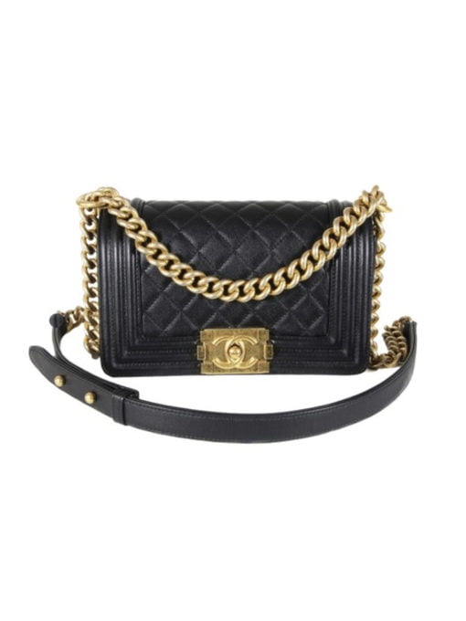 CHANEL 'Boy' Diamond Quilted Leather Flap Bag. Original Quality Bag including gift box, care book, dust bag, authenticity card. Created by Karl Lagerfeld, the iconic design owes its name to Gabrielle Chanel's first love, Boy Capel. This Chanel Boy Flap Bag Quilted is every woman's dream. Crafted from calfskin leather, the bag features Chanel's signature diamond quilting, chunky chain link strap with leather shoulder pad, and metal-tone hardware accents. Its CC Boy logo closure opens to a fabric-lined interior with slip pocket perfect for daily essentials. A sought-after, luxurious accessory. | CRIS&COCO Authentic Quality bags and Accessories