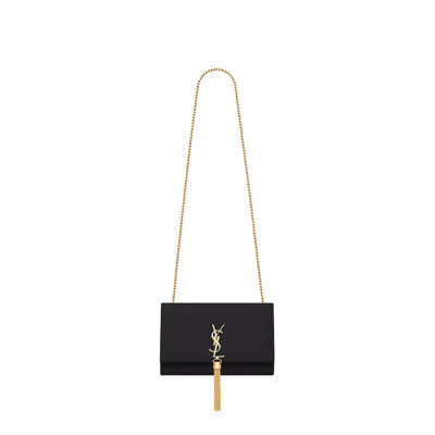 SAINT LAURENT Small 'Kate' Bag with Tassel. Original Quality Bag including gift box, care book, dust bag, authenticity card. Monogram Saint Laurent bag adorned with a curb chain, interlocking YSL initials in metal, and a metallic tassel. Crafted from leather, this Kate shoulder bag from Saint Laurent is decorated with a signature YSL monogram plaque and a hanging tassel detail to the front for an extra refined touch. The perfect go-to for a night out. Featuring a chain shoulder strap, a foldover top with magnetic closure, a main internal compartment, an internal slip pocket, an internal logo patch, an internal logo stamp, and metal hardware. | CRIS&COCO Authentic Quality Designer Bags and Luxury Accessories