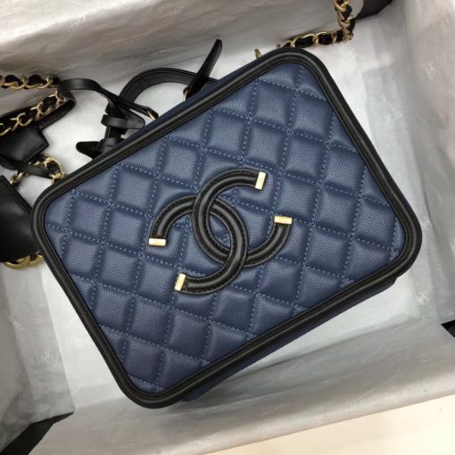 CHANEL Vanity Case Shoulder Bag and Crossbody. Original, authentic quality bag. Genuine Calf Leather. Metal Hardware. Authentic Packaging. Original Quality Dust Bag. Authenticity Card. This iconic CHANEL bag was first released for the Spring-Summer 2016 Collection. Iterations are dropped every new season. This bag is in beautiful grained calfskin leather with brushed metal-tone hardware. It features an embroidered CC stitched logo, a single flat top handle, two hanging clochettes. Its inside is lined with calfskin leather. | CRIS&COCO | High quality designer bags and luxury accessories