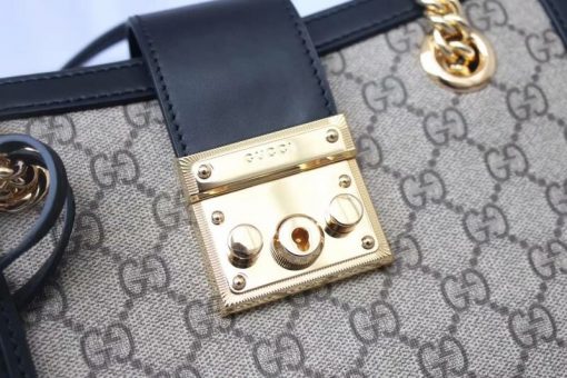 GUCCI Padlock Small GG Shoulder Bag. Authentic Quality Bag with literature, gift box, dust bag and authenticity card. A structured shoulder bag in GG Supreme canvas with a strap that secures with a key lock closure pulled straight from the archives. The key is placed in a detachable leather key case. | CRIS&COCO High-End Designer Bags and Luxury Accessories