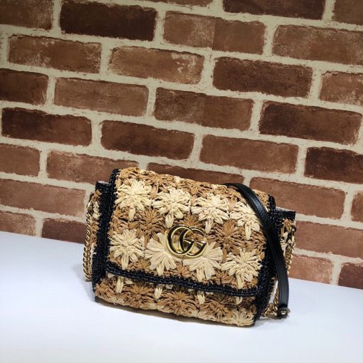 GUCCI GG Marmont Raffia small shoulder bag. Authentic Quality Bag, including gift box, literature, dust bag, authenticity card. An introduction to the GG Marmont line, the small shoulder bag is introduced in the season's coveted raffia effect fabric. An unexpected take on the signature style blends the Double G emblem with the seasonal fabric, reworked to create a textured floral motif that is accented by a black trim and leather details. New shapes and signature Gucci lines are reimagined in a mix of fabrics and trims imbued with an inherent summer feel. | CRIS&COCO Authentic Quality Designer Bag and Luxury Accessories