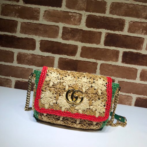 GUCCI GG Marmont Raffia small shoulder bag. Authentic Quality Bag, including gift box, literature, dust bag, authenticity card. An introduction to the GG Marmont line, the small shoulder bag is introduced in the season's coveted raffia effect fabric. An unexpected take on the signature style blends the Double G emblem with the seasonal fabric, reworked to create a textured floral motif that is accented by a black trim and leather details. New shapes and signature Gucci lines are reimagined in a mix of fabrics and trims imbued with an inherent summer feel. | CRIS&COCO Authentic Quality Designer Bag and Luxury Accessories