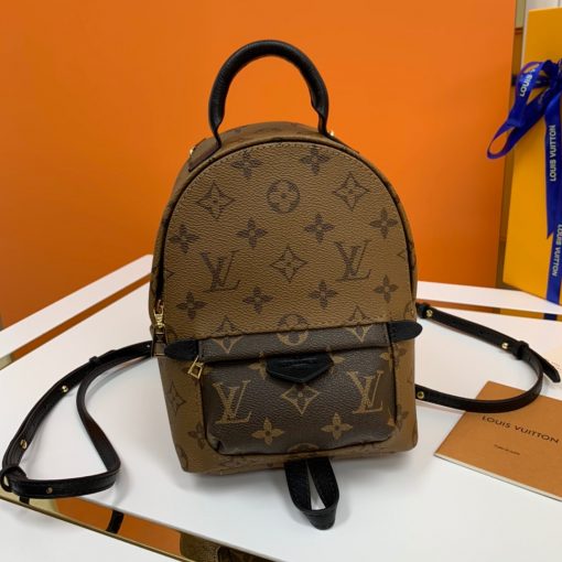 LOUIS VUITTON Palm Springs Mini Back Pack. Original Quality Bag including gift box, literature, dust bag, authenticity card. The Palm Springs Mini gives a fresh twist to the backpack, transforming a utilitarian staple into an on-point city bag. An essential accessory for sporty urban nomads, this charming model is crafted from Monogram canvas with soft leather trim and gold-tone hardware. The quilted, foam-backed straps can be positioned in multiple ways, for shoulder or cross-body wear. | Cris and Coco Authentic Quality Designer Bags and Luxury Accessories