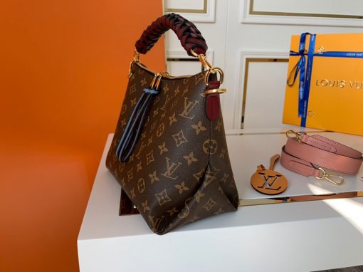 LOUIS VUITTON Beaubourg Hobo Mini Handbag. Authentic Quality Bag, including gift box, literature, dust bag, authenticity card. The adorable Beaubourg Hobo Mini handbag in Monogram canvas comes with a stylishly braided top handle. The House’s exceptional leather craftsmanship can be seen in the hand-painted edge dyeing on the braids. The oversized LV charm adds a sophisticated touch while the colorful name tag and shoulder strap bring a playful feel. This is an excellent handbag, ideal for day wear. | Cris and Coco Authentic Quality Designer Bags and Luxury Accessories