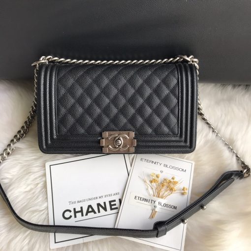 CHANEL Boy Quilted Leather Flap Bag. Original Quality Bag including gift box, literature, dust bag, authenticity card. This stand-out, enviable CHANEL Boy quilted flap bag features a chunky chain-link strap with shoulder pad, CC Boy logo push-lock closure, and antiqued hardware accents. Its push-lock closure opens to a black fabric-lined interior with side zip and slip pockets to secure daily essentials. | Cris and Coco Designer Bags and Accessories