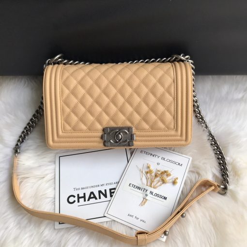 CHANEL Boy Quilted Leather Flap Bag. Original Quality Bag including gift box, literature, dust bag, authenticity card. This stand-out, enviable CHANEL Boy quilted flap bag features a chunky chain-link strap with shoulder pad, CC Boy logo push-lock closure, and antiqued hardware accents. Its push-lock closure opens to a black fabric-lined interior with side zip and slip pockets to secure daily essentials. | Cris and Coco Designer Bags and Accessories