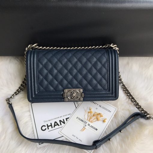 CHANEL Boy Quilted Leather Flap Bag. Original Quality Bag including gift box, literature, dust bag, authenticity card. This stand-out, enviable CHANEL Boy quilted flap bag features a chunky chain-link strap with shoulder pad, CC Boy logo push-lock closure, and antiqued hardware accents. Its push-lock closure opens to a black fabric-lined interior with side zip and slip pockets to secure daily essentials. | Cris and Coco Designer Bags and Accessories