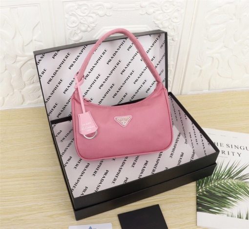 PRADA Re-Edition 2000 Nylon Mini Hobo. High-End Bag including gift box, dust bag, literature, and authenticity card. Practical and feminine, the nylon mini bag is decorated with iconic Saffiano leather trim. It features a contemporary mix of materials. | CRIS and Coco High-End Luxury Accessories