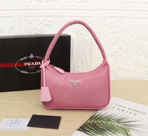 PRADA Re-Edition 2000 Nylon Mini Hobo. High-End Bag including gift box, dust bag, literature, and authenticity card. Practical and feminine, the nylon mini bag is decorated with iconic Saffiano leather trim. It features a contemporary mix of materials. | CRIS and Coco High-End Luxury Accessories