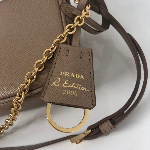 PRADA Re-Edition 2000 Shoulder Bag. Original Quality Bag, including gift box, literature, dust bag, authenticity card. Re-proposing iconic nylon bags from 2000, Prada reinterprets the mini-bag, now in Saffiano leather. The bag with double shoulder strap in leather and metal chain stands out for its removable Saffiano leather name tag. | Cris and Coco Designer Bags and Accessories