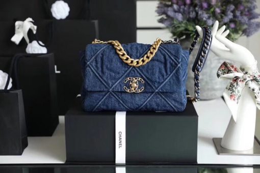 Chanel '19' Flap Bag in Blue Denim 2020. Original Quality Bag including gift box, care book, dust bag, authenticity card. This gorgeous Chanel '19' Flap Bag in Blue Denim is the most sought after bag this year by CHANEL. Gorgeous and so on-trend. Guaranteed authentic and comes with proof of purchase! Please be advised that this is the Larger size, not the medium. Sold out globally. This style is no longer available from Chanel and discontinued in denim. A great investment piece. | CRIS&COCO Authentic Quality Designer Bag and Luxury Accessories