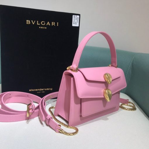 ALEXANDER WANG x BVLGARI Belt Bag. Original Quality Bag including gift box, care book, dust bag, authenticity card. The belt bag is a dream to style, as it features two detachable straps and a detachable handle and can be worn on the waist, as a crossbody bag, as a clutch or over the shoulder. BVLGARI and ALEXANDER WANG have reprised Serpenti Through The Eyes of ALEXANDER WANG for 2020, with the exciting addition of two brand new bags. While the two in-demand fashion houses may not reveal themselves to be the most obvious collaborators at a superficial glance, they have nonetheless merged to produce their latest capsule collection infusing allure with innovation. | Cris and Coco Authentic Quality designer bags and luxury accessories.