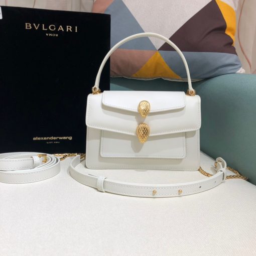 ALEXANDER WANG x BVLGARI Belt Bag. Original Quality Bag including gift box, care book, dust bag, authenticity card. The belt bag is a dream to style, as it features two detachable straps and a detachable handle and can be worn on the waist, as a crossbody bag, as a clutch or over the shoulder. BVLGARI and ALEXANDER WANG have reprised Serpenti Through The Eyes of ALEXANDER WANG for 2020, with the exciting addition of two brand new bags. While the two in-demand fashion houses may not reveal themselves to be the most obvious collaborators at a superficial glance, they have nonetheless merged to produce their latest capsule collection infusing allure with innovation. | Cris and Coco Authentic Quality designer bags and luxury accessories.