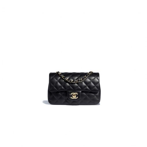 CHANEL Classic New Mini 20 cm Flap Bag. Original Quality Bag including gift box, care book, dust bag, authenticity card. This chic petite shoulder bag is crafted of luxurious shimmery lambskin leather. The crossbody bag features a long chain-link leather threaded shoulder strap and front flap with a CC turn lock. The flap opens to an interior of matching leather with zipper and patch pockets. Enjoy this fabulous bag for everyday essentials or special events with this timeless classic. | CRIS AND COCO High Quality Bags and Luxury Accessories