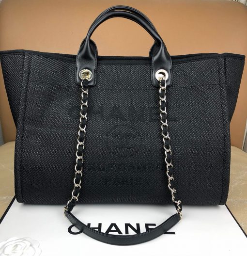 CHANEL Large Deauville Shopping Bag 2021. Authentic quality bag including gift box, booklet, dust bag, authenticity card. The CHANEL Deauville tote matured to a signature CHANEL bag. The bestseller Deauville often appears in seasonal launches in unexpected colors and materials. On the CHANEL website, Chanel calls it the Shopping Bag, but if you walk into a CHANEL boutique and ask for the Deauville, you will be directed to this tote bag. | Cris and Coco Authentic Quality Designer Bags and Luxury Accessories