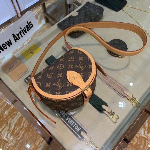 LOUIS VUITTON Tambourin Monogram Crossbody Bag. Original Quality Bag including gift box, care book, dust bag, authenticity card. Nicolas Ghesquière introduces a new version of the versatile and easy-to-wear LOUIS VUITTON Tambourin Monogram Crossbody Bag, made from Monogram canvas and natural cowhide leather. Small and lightweight with a practical inside pocket, this functional bag is ideal for everyday use. It can be worn over the shoulder or cross-body. | CRIS&COCO Authentic Quality Designer Bags and Luxury Accessories