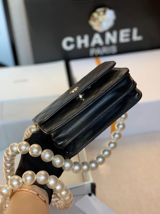 CHANEL Mini Wallet On Chain With Imitation Pearls. Original Quality Wallet including gift box, care book, dust bag, authenticity card. This CHANEL Mini Wallet On Chain With Imitation Pearl comes with an oversized pearl strap. It’s like a dream that comes true. There are so many pearls that keep our heart-melting. And also they’re extremely large pearls as well. | CRIS&COCO Authentic Quality Designer Bags and Luxury Accessories