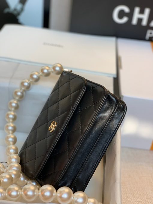 CHANEL Mini Wallet On Chain With Imitation Pearls. Original Quality Wallet including gift box, care book, dust bag, authenticity card. This CHANEL Mini Wallet On Chain With Imitation Pearl comes with an oversized pearl strap. It’s like a dream that comes true. There are so many pearls that keep our heart-melting. And also they’re extremely large pearls as well. | CRIS&COCO Authentic Quality Designer Bags and Luxury Accessories