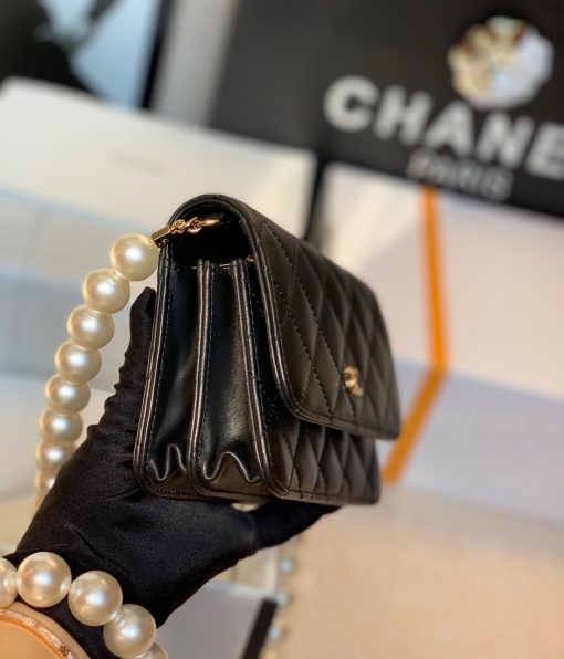 CHANEL Mini Wallet On Chain With Imitation Pearls. Original Quality Wallet including gift box, care book, dust bag, authenticity card. This CHANEL Mini Wallet On Chain With Imitation Pearl comes with an oversized pearl strap. It’s like a dream that comes true. There are so many pearls that keep our heart-melting. And also they’re extremely large pearls as well. | CRIS&COCO Authentic Quality Designer Bags and Luxury Accessories