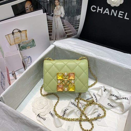 CHANEL Small Flap Bag with Crystal Pearls and Resin. Original Quality Bag including gift box, care book, dust bag, authenticity card. Chanel has introduced the Small Flap Bag in a bejeweled variant at Fall-Winter 2020/21 season. The bag is subtly blingy featuring faux pearls and Chanel’s Gripoix (poured glass jewels) on the clasp. | CRIS&COCO Authentic Quality Designer Bags and Luxury Accessories