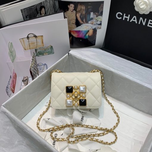 CHANEL Small Flap Bag with Crystal Pearls and Resin. Original Quality Bag including gift box, care book, dust bag, authenticity card. Chanel has introduced the Small Flap Bag in a bejeweled variant at Fall-Winter 2020/21 season. The bag is subtly blingy featuring faux pearls and Chanel’s Gripoix (poured glass jewels) on the clasp. | CRIS&COCO Authentic Quality Designer Bags and Luxury Accessories