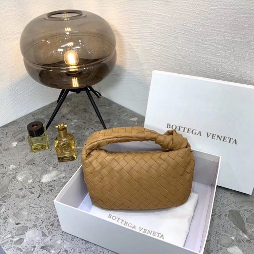 BOTTEGA VENETA The Jodie Hobo Bag. Original Quality Bag including gift box, care book, dust bag, authenticity card. This rounded mini hobo bag in woven leather is woven by hand with a curved, seamless structure. It has Iconic Intrecciato 15 weaves in a subtly amplified new dimension. This bag is soft, draped shape with knot detail on the handle. | CRIS&COCO Authentic Quality Designer Bags and Luxury Accessories