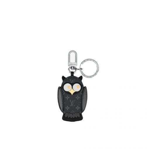 LOUIS VUITTON Owl Bag-Charm & Key Holder. Original Quality Charm including gift box, care book, dust bag, authenticity card. The mascot on the Owl bag charm and key holder is brought to life with LV studs for eyes and a Monogram Flower beak. Gold-color hardware joins calf leather and Monogram Eclipse canvas in a playful mingling of the House's signature materials. The hook and ring on this are both engraved with the Louis Vuitton signature for an elegant finish. | CRIS&COCO Authentic Quality Designer Bags and Luxury Accessories