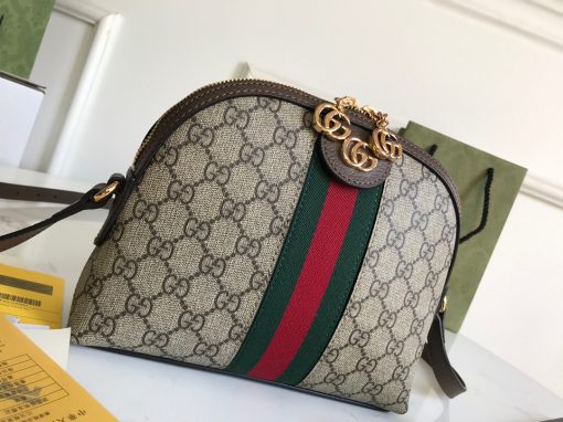 GUCCI Ophidia GG Small Rounded Top Shoulder Bag. Original Quality Bag including gift box, care book, dust bag, authenticity card. This rounded top shoulder bag is a heritage-inspired addition to accessories edit. Complete with the label's signature motifs – GG Supreme print, green and red Web, and golden-tone hardware – it's a perfect modern interpretation of coveted vintage pieces. Carry the runway design with tailored looks for effortless workwear style. | CRIS&COCO Authentic Quality Designer Bags and Luxury Accessories