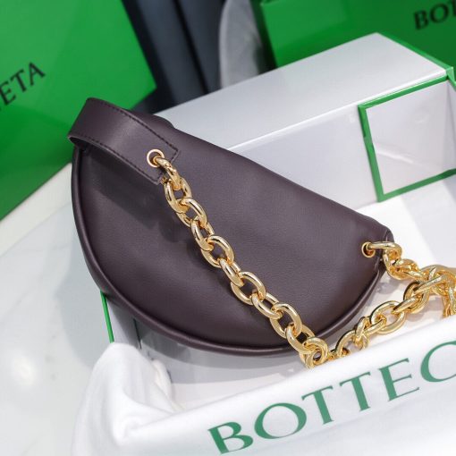 BOTTEGA VENETA Belt Chain Pouch. Fashion can be functional too and this Belt Chain pouch from Bottega Veneta is proof of that. It's perfect for days when you want to go hands-free. This smaller pouch in soft leather with one main compartment inside, leather interior, metal frame fastening, adjustable chain strap with carabiner fastening. Can be worn as a belt bag or crossbody. | CRIS&COCO Authentic Quality Designer Bags and Luxury Accessories