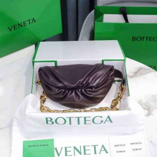 BOTTEGA VENETA Belt Chain Pouch. Fashion can be functional too and this Belt Chain pouch from Bottega Veneta is proof of that. It's perfect for days when you want to go hands-free. This smaller pouch in soft leather with one main compartment inside, leather interior, metal frame fastening, adjustable chain strap with carabiner fastening. Can be worn as a belt bag or crossbody. | CRIS&COCO Authentic Quality Designer Bags and Luxury Accessories