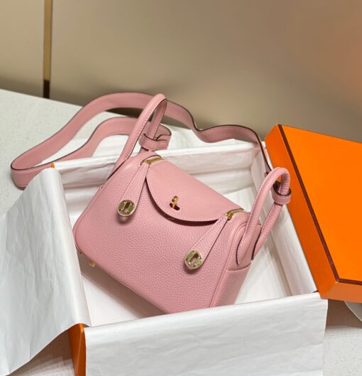 HERMÈS Mini Lindy. High-end quality bag including gift box, literature, dust bag, authenticity card. Maison HERMÈS is elevating the Lindy, with the introduction of the new Mini and is joining the holy Trinity, the Birkin, Kelly, and Constance.| CRIS AND COCO Authentic Quality Luxury Accessories