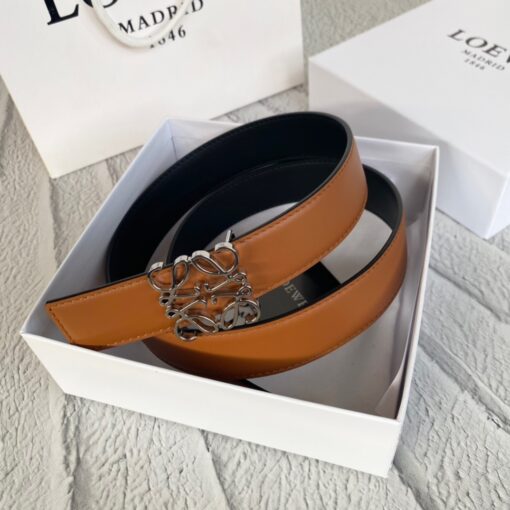 LOEWE Anagram Belt. Original Quality Belt including gift box, care book, dust bag, authenticity card. This belt is crafted in smooth calfskin with a LOEWE Anagram buckle. The label’s now-iconic Anagram – rendered in gleaming golden/silver/black tone metal – takes no lesser pride of place, though. Originally designed in 1970 in homage to the label’s founder and refreshed when Jw Anderson took over the reins, it’s an icon that points to the past and future at once.  | CRIS&COCO Authentic Quality Designer Bag and Luxury Accessories