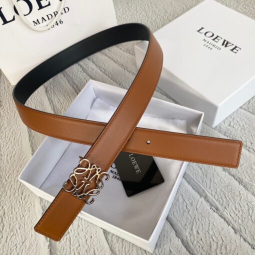 LOEWE Anagram Belt. Original Quality Belt including gift box, care book, dust bag, authenticity card. This belt is crafted in smooth calfskin with a LOEWE Anagram buckle. The label’s now-iconic Anagram – rendered in gleaming golden/silver/black tone metal – takes no lesser pride of place, though. Originally designed in 1970 in homage to the label’s founder and refreshed when Jw Anderson took over the reins, it’s an icon that points to the past and future at once.  | CRIS&COCO Authentic Quality Designer Bag and Luxury Accessories