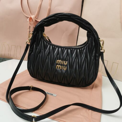 MIU MIU Wander Matelassé Mini Hobo Bag. Original Quality Bag including gift box, care book, dust bag, authenticity card. The Miu Wander bag is reinterpreted season after season, becoming an iconic accessory of Miu Miu collections. Made of matelassé nappa leather, the bag is characterized by the sophisticated, three-dimensional effect created by the refined workmanship. The hobo shape, blending retro inspirations and contemporary elegance, becomes a new synonym of modern femininity. | CRIS&COCO Authentic Quality Designer Bag and Luxury Accessories