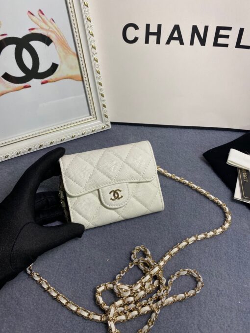 CHANEL Classic Mini Clutch With Chain. Original Quality Bag including gift box, care book, dust bag, authenticity card. The Chanel Classic Mini Clutch is the true authentic beauty because it resembles the Classic Flap Bag. It’s also the mini version of the Clutch With Chain Bag. This Mini Clutch is really tiny. But tiny has its advantage because it can be used in numerous ways. Especially this handbag as it comes with a long chain for shoulder carry. This one can be used as an extra wallet inside your bag. At night it can be carried as an adorable evening accessory. | CRIS&COCO Authentic Quality Designer Bags and Luxury Accessories