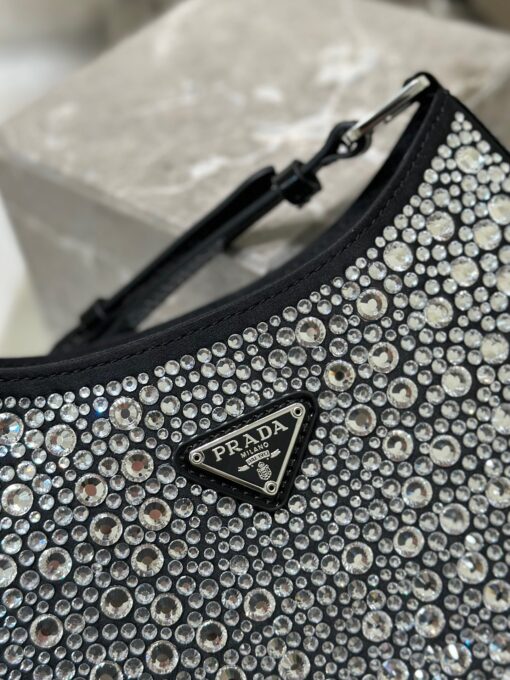 PRADA Cleo Satin Bag With Crystals. Original Quality Bag including gift box, care book, dust bag, authenticity card. Feminine, elegant and modern, the Prada Cleo bag is made of satin and embellished with luminous crystals of different sizes that give the bag refined charm. The sinuous shape that recalls archive styles makes the accessory iconic. | CRIS&COCO Authentic Quality Designer Bags and Luxury Accessories