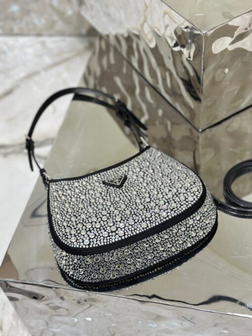 PRADA Cleo Satin Bag With Crystals. Original Quality Bag including gift box, care book, dust bag, authenticity card. Feminine, elegant and modern, the Prada Cleo bag is made of satin and embellished with luminous crystals of different sizes that give the bag refined charm. The sinuous shape that recalls archive styles makes the accessory iconic. | CRIS&COCO Authentic Quality Designer Bags and Luxury Accessories