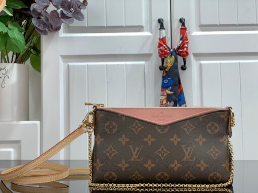 LOUIS VUITTON Pallas Clutch Bag. Original Quality Bag including gift box, care book, dust bag, authenticity card. It’s covered in Monogram Canvas and has multiple carry options like on your shoulder or even cross body. Make use of the leather strap or the golden chain. Use it as a Wallet on Chain bag, it’s just ideal for the evenings or when you want to carry a small but gorgeous handbag. Also, it matches to every casual outfit. This Clutch Bag is refined with golden color metallic pieces; it comes with zipped central compartment and an exterior front pocket. | CRIS&COCO Authentic Quality Designer Bags and Luxury Accessories