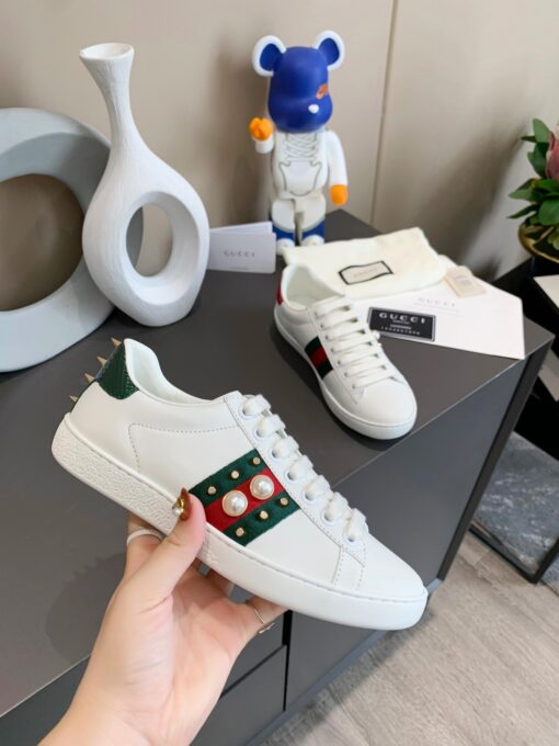 GUCCI Sneaker. Original Quality Sneaker including gift box, care book, dust bag, authenticity card. The classic low-top sneaker in leather with Web detail. These are so great that they would soon become a part of your every day wardrobe. | CRIS&COCO Authentic Quality Designer Bags and Luxury Accessories