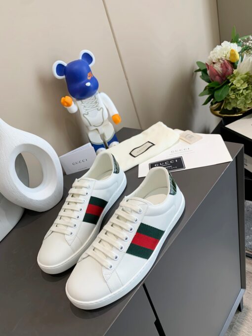 GUCCI Sneaker. Original Quality Sneaker including gift box, care book, dust bag, authenticity card. The classic low-top sneaker in leather with Web detail. These are so great that they would soon become a part of your every day wardrobe. | CRIS&COCO Authentic Quality Designer Bags and Luxury Accessories