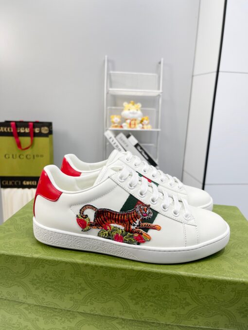 GUCCI Sneaker. Original Quality Sneaker including gift box, care book, dust bag, authenticity card. The classic low-top sneaker in leather with Web detail. These are so great that they would soon become a part of your every day wardrobe. | CRIS&COCO Authentic Quality Designer Bags and Luxury Accessories