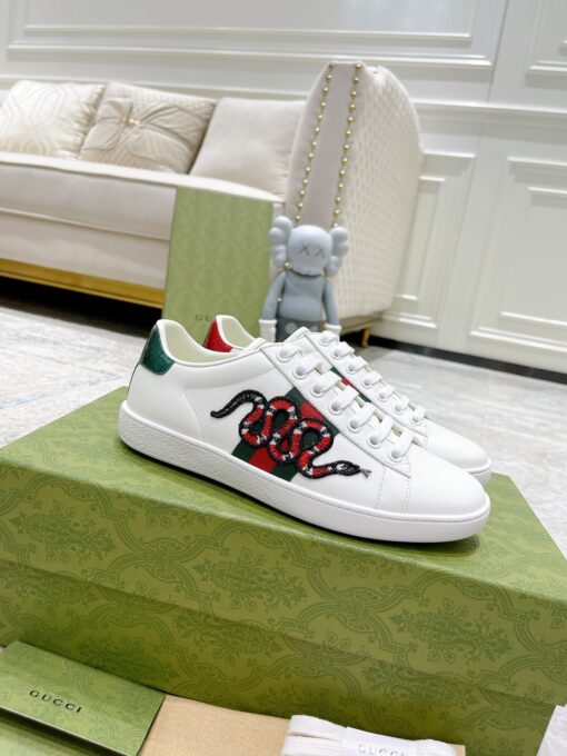 GUCCI Sneaker. Original Quality Sneaker including gift box, care book, dust bag, authenticity card. The classic low-top sneaker in leather with Web detail. These are so great that they would soon become a part of your every day wardrobe. | CRIS&COCO Authentic Quality Designer Bags and Luxury Accessories