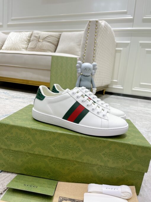 GUCCI Sneaker. Original Quality Sneaker including gift box, care book, dust bag, authenticity card. The classic low-top sneaker in leather with Web detail. These are so great that they would soon become a part of your every day wardrobe. | CRIS&COCO Authentic Quality Designer Bags and Luxury Accessories