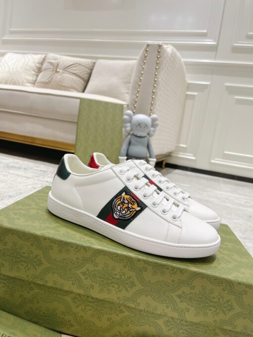 GUCCI Sneaker. Original Quality Sneaker including gift box, care book, dust bag, authenticity card. The classic low-top sneaker in leather with Web detail. These are so great that they would soon become a part of your every day wardrobe. | CRIS&COCO Authentic Quality Designer Bags and Luxury Accessories