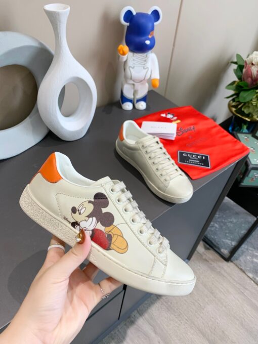 GUCCI Sneaker. Original Quality Sneaker including gift box, care book, dust bag, authenticity card. The classic low-top sneaker in leather with Web detail. These are so great that they would soon become a part of your every day wardrobe. | CRIS&COCO Authentic Quality Designer Bags and Luxury Accessories