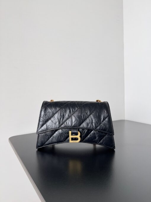 BALENCIAGA Crush Small Chain Bag. Original Quality Bag including gift box, care book, dust bag, authenticity card. Crush on this metallic Crush Chain Bag. This is a new iteration on their celebrated curvilinear design, complete with tonal B logo hardware and shoulder and crossbody chain. Crafted in a contemporary crushed quilted calfskin. | CRIS&COCO Authentic Quality Designer Bags and Luxury Accessories