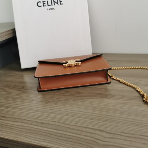 CELINE Wallet On Chain Triomphe. Original Quality Bag including gift box, care book, dust bag, authenticity card. Looking for a reasonable priced high fashion WOC. Take a look at this latest Celine Wallet On Chain from the Spring Summer 2021 Collection. Made from calfskin, this WOC is made for flaunting. The center comes with the famous Triomphe CC logo. There are different colors available, but the bag comes with a chain colored in gold hardware. The chain can also be removed so you can turn it into an evening clutch. You also get a shoulder pad. | CRIS&COCO Authentic Quality Designer Bags and Luxury Accessories