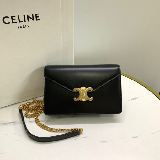 CELINE Wallet On Chain Triomphe. Original Quality Bag including gift box, care book, dust bag, authenticity card. Looking for a reasonable priced high fashion WOC. Take a look at this latest Celine Wallet On Chain from the Spring Summer 2021 Collection. Made from calfskin, this WOC is made for flaunting. The center comes with the famous Triomphe CC logo. There are different colors available, but the bag comes with a chain colored in gold hardware. The chain can also be removed so you can turn it into an evening clutch. You also get a shoulder pad. | CRIS&COCO Authentic Quality Designer Bags and Luxury Accessories