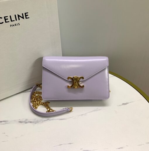 CELINE Wallet On Chain Triomphe. Original Quality Bag including gift box, care book, dust bag, authenticity card. Looking for a reasonable priced high fashion WOC. Take a look at this latest Celine Wallet On Chain from the Spring Summer 2021 Collection. Made from calfskin, this WOC is made for flaunting. The center comes with the famous Triomphe CC logo. There are different colors available, but the bag comes with a chain colored in gold hardware. The chain can also be removed so you can turn it into an evening clutch. You also get a shoulder pad. | CRIS&COCO Authentic Quality Designer Bags and Luxury Accessories