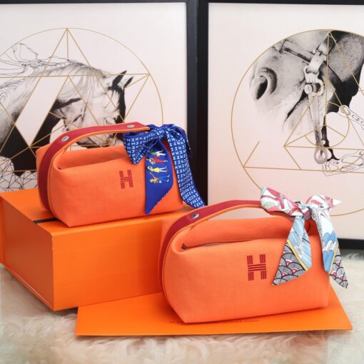 HERMÈS Bride-A-Brace Case. Original Quality Bag including gift box, care book, dust bag, authenticity card. It might have slipped our attention, but we think the Hermes Bride-A-Brace Case is a must have for anyone serious high fashion collectors. This case can be used as a pouch or even for beach and holiday. It can also be used as a toiletry bag and I think the design is adorable. So there is no doubt, the Hermes Bride-A-Brace Case is very popular. These cases are made from canvas with anti-stain water-repellent chevron lining, which is cotton. It’s embroidered with a modern ‘H’ logo on the front. These cases are single colored. And just take a look at the gorgeous details. The handle is designed from the sides to the top. And it’s linked together with what-appears-to-be a push button. We also love the beautiful shape. | CRIS&COCO Authentic Quality Designer Bags and Luxury Accessories